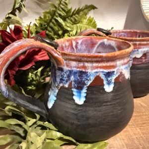Black and purples stoneware mug .