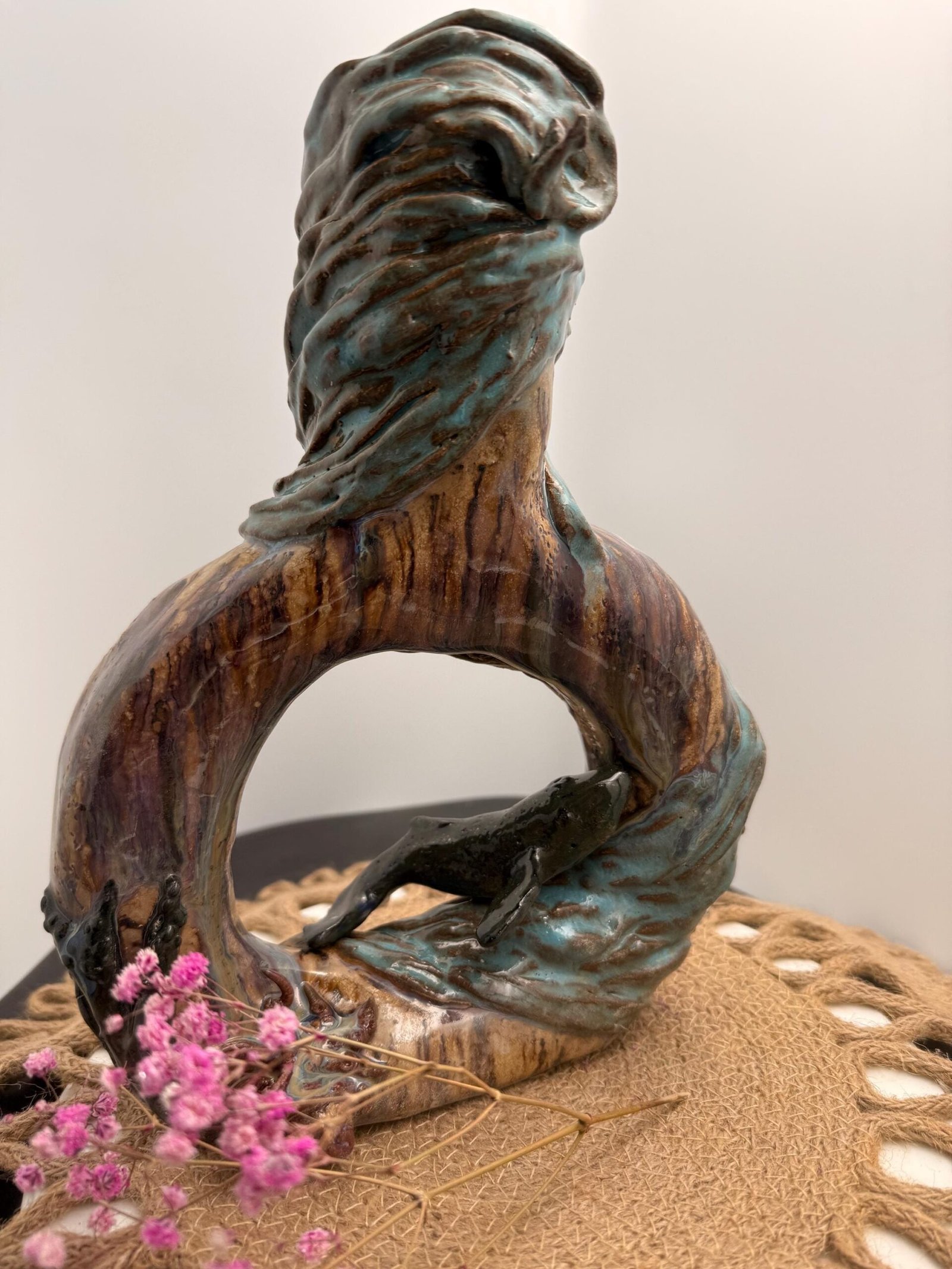 Hand sculpted stoneware blue whale vase.